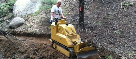 mini dozer vs mini excavator for building trails|trail dozer tool.